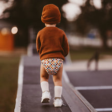 Load image into Gallery viewer, Toddler wearing a Lighthouse Kids Supreme all-in-one cloth nappy - checkers skater print- Peanut and Poppet UK