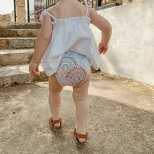 Load image into Gallery viewer, Child wearing The Gentle Mama Co Sundown pocket nappy - Peanut and Poppet UK