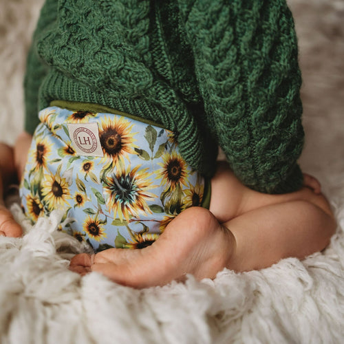Toddler wearing Lighthouse Kids Switch Supreme in Sunflowers - All-in-Two cloth nappy - Peanut and Poppet