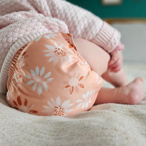 Baby wearing Little Poppet Pull-Up and Pocket in Peach Blossom - Peanut and Poppet UK