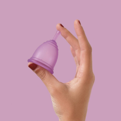Person holding Ruby Cup medium in purple - eco-friendly period - Peanut and Poppet UK