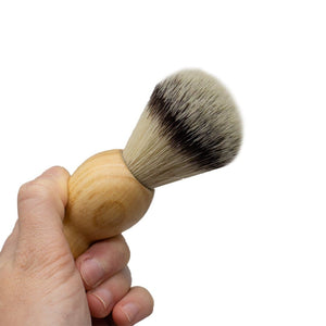 holding a Ecovibe shaving brush - vegan - Peanut and Poppet UK