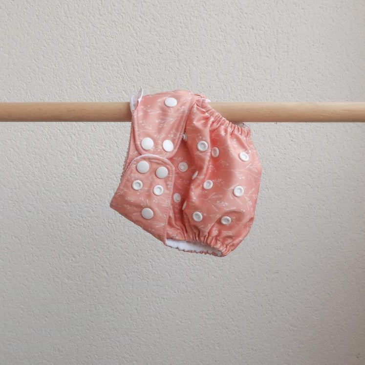 The Gentle Mama Co Clementine pocket nappy - Coral nappy with white dainty leaf print - Peanut and Poppet UK